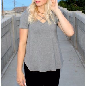Grey top with cross cross neck details